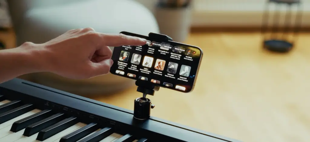 Someone selecting a classical piece of music on a piano app interface