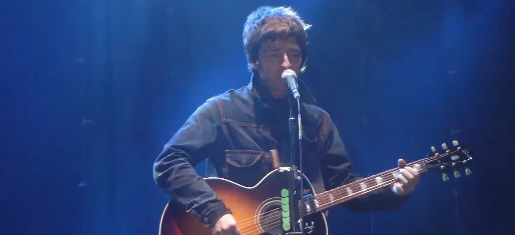 Noel Gallagher didn’t study guitar. He taught himself, and it shows in every Oasis riff.